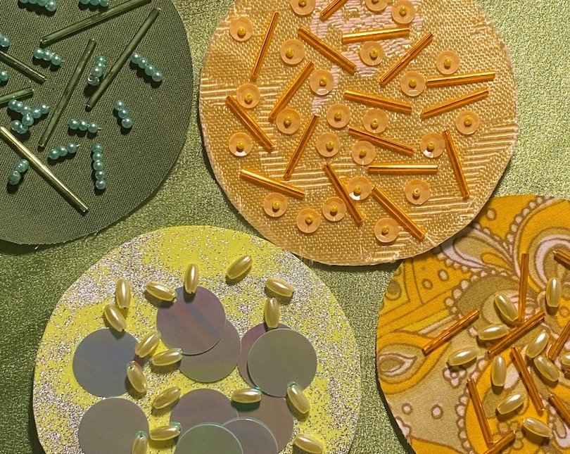 Round shapes with beads sewn onto them