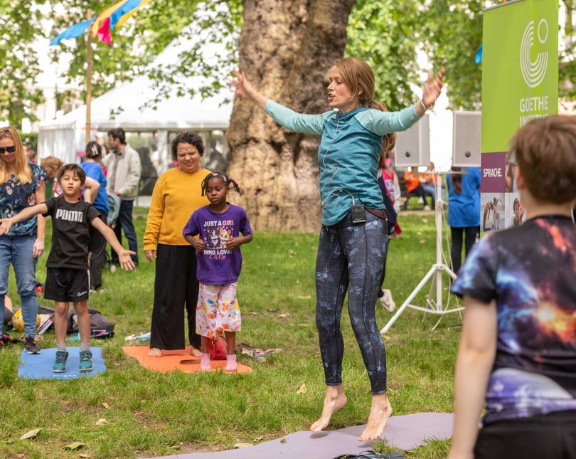 A group of children doing yoga