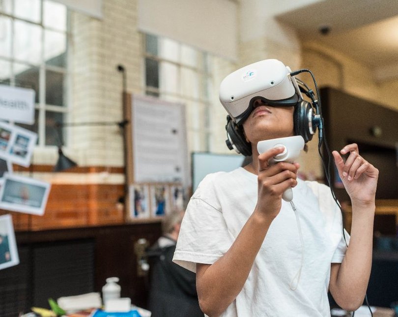 Young person wearing VR headset